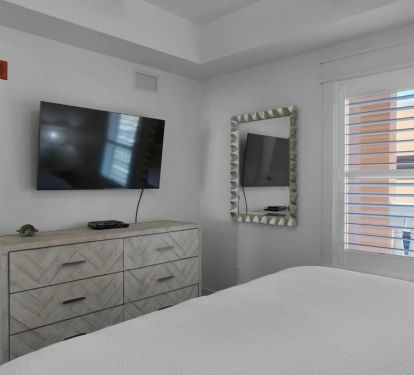 Smart 65-inch TV in Master Bedroom