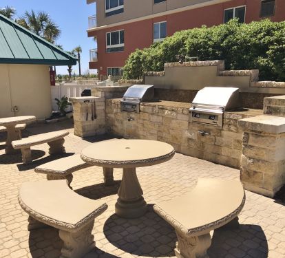 BBQ area has gas and charcoal grills with picnic tables