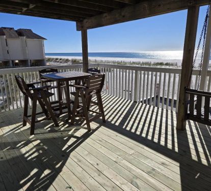 Large private deck with porch swing and table. A great place to enjoy for all.