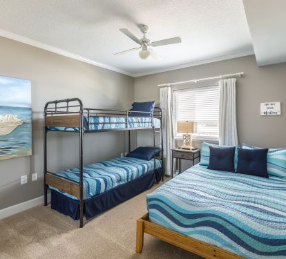 Large second bedroom with attached double sink bathroom