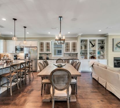 Dining area with seating for 14 at table and counter.