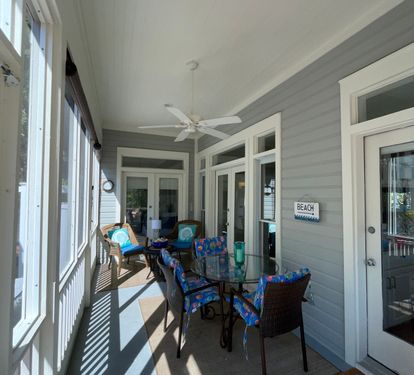 Back screened porch overlooks The Promenade