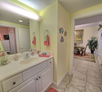 FROM GUEST BEDROOM INTO GUEST BATH. ALSO LOOKING INTO DINING AREA