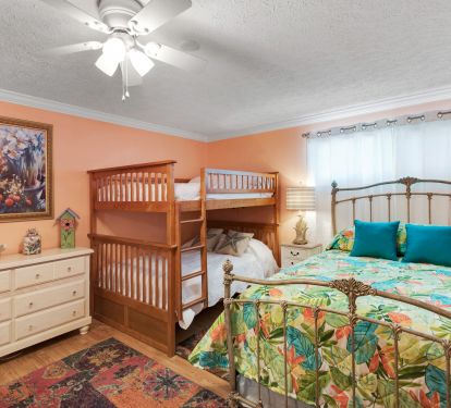 3rd bedroom with a queen bed and two full-over-full bunk beds
