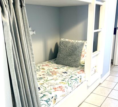 Twin size bunk beds in the hallway.