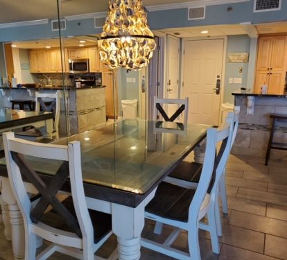 New dining table w/bench seat, 4 chairs and ocean views.  Open living concept