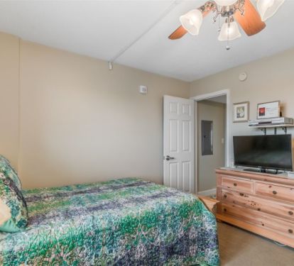 Guest Bedroom with 32 inch TV and Ceiling Fan