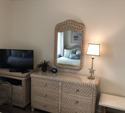The spacious wicker dresser has room for all of your things.