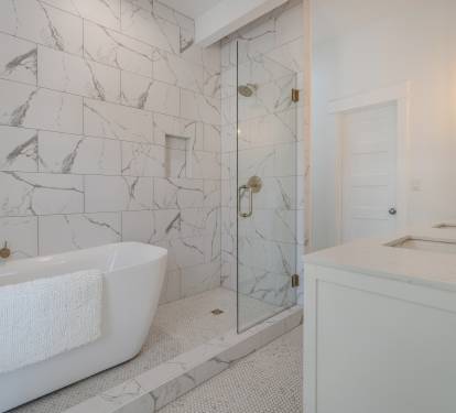 Primary Suite 2 ensuite bath with double vanity, shower and soaking tub