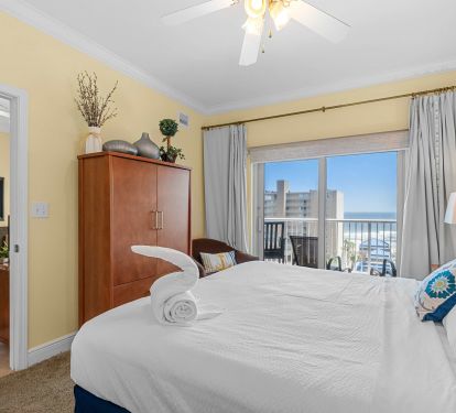 Master Bedroom has a king bed with a view.