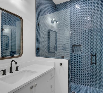 Unique bathroom tile design with walk in shower.