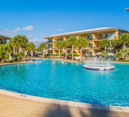 Fountain in background of huge  8000 square foot pool