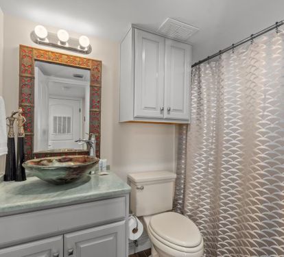 Custom decorative glass sinks in each bathroom. Zoom in to this one. L&rsquo;Occitane!