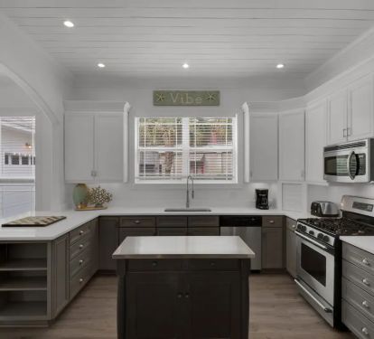 Vibe-11 Brand new quartz counters with gas range and fully equipped kitchen stand ready for your culinary masterpiece.
