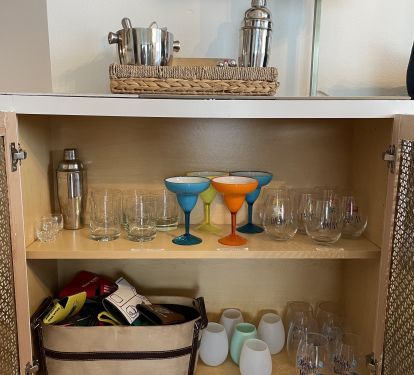 A full bar set-up for the adults in the other cabinets. Enjoy a glass of wine!!
