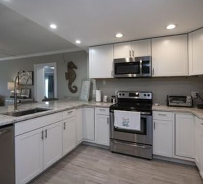 The spacious, fully stocked kitchen is a great place to cook all your meals! 
