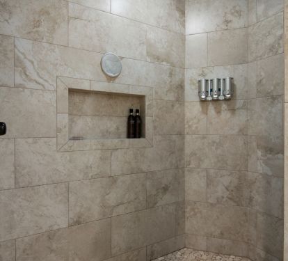 This unit's walk in master shower is a custom one, unique and luxurious