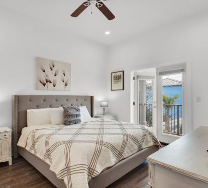 King Bedroom with private bathroom and access to deck overlooking the pool