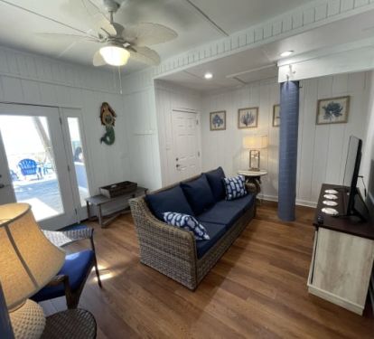 New Beach Level Apartment Living Room - doors to beach and interior stairs