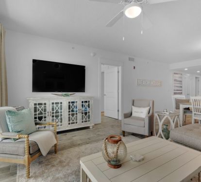 Living room area includes a 65'' smart TV