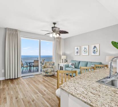 Living Room: Enjoy stunning ocean views and bright d&eacute;cor in this inviting space space!