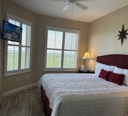 King Size Bed in Guest Room, Wall Mounted TV