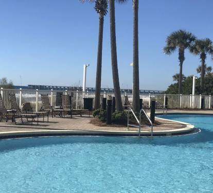 Large gulfside pool and second heated pool streetside. Hot tubs on both sides