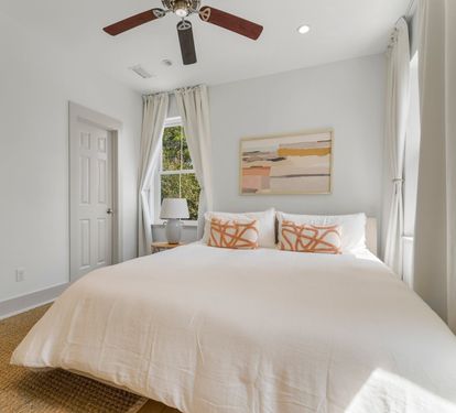 Second-floor King Suite 3 is on the quiet back side of the house with soft coastal light