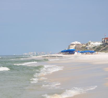 650 feet of beautiful white sand beach overlooking emerald waters! Beach chairs provided.