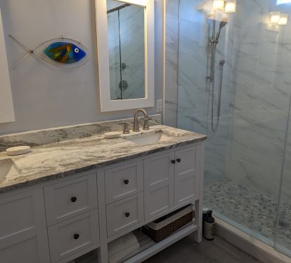 Master Bathrooms have quartz counters, double sinks and large tile shower