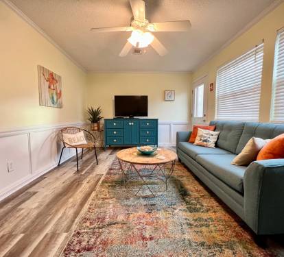 The living room features brand new furniture installed in January, 2023.