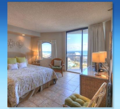 The master features a king sized bed , en-suite bath, and balcony access!