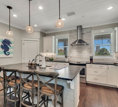 Large Kitchen stocked with plenty of dishes and cookware and closet pantry.