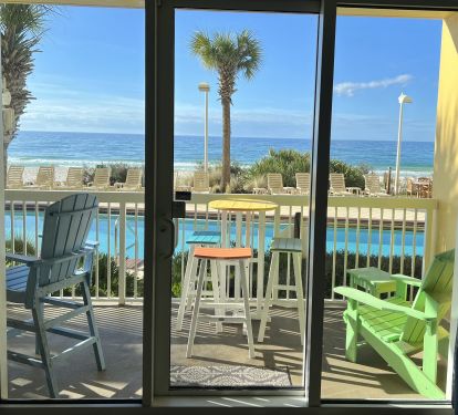 LIFE IS GOOD on this balcony with 2 table sets and Adirondack chair. TOYS TOO!