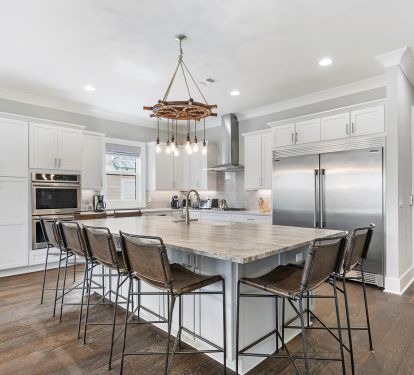 Kitchen has custom lighting and double oven