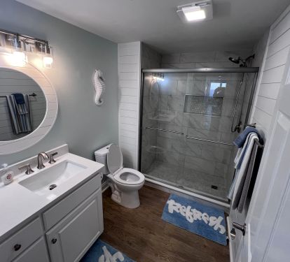 Guest bath with walk-in shower and quartz countertops