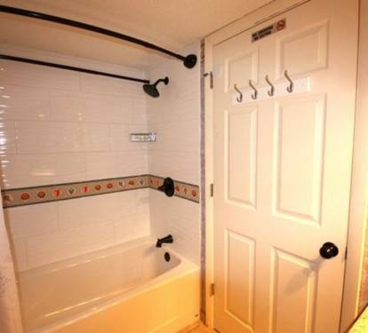 New tub / shower and new tiled surround