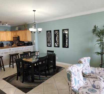 Dining area with additional breakfast bar seating.