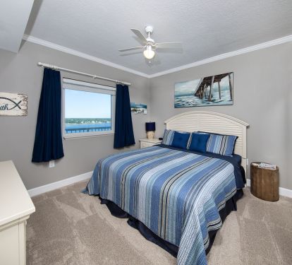 Master king bed with view of lagoon.