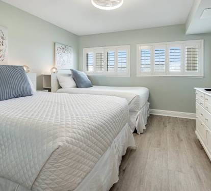 guest suite with two full beds