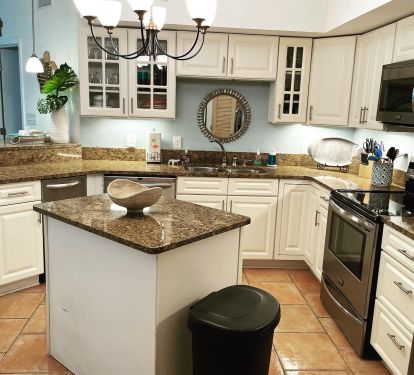Kitchen is fully stocked along with a great view of the water.