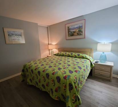 Bedroom with new king mattress and box spring.  New flooring. 