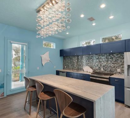 Aqua-9 Eat in the kitchen with a waterfall, granite island, and new stainless appliances.
