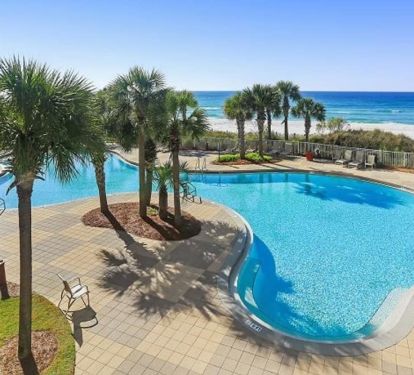 Tropical Lagoon Pool with Community Grilling Area and Seating