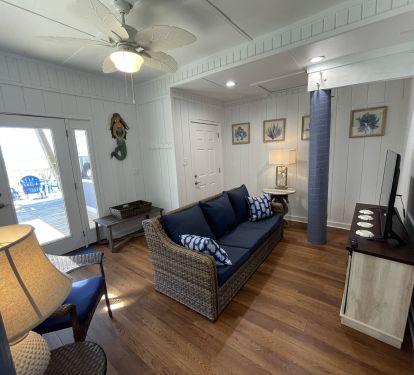 New Beach Level Apartment Living Room - doors to beach and interior stairs