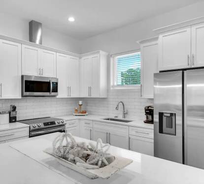 Bliss-4 New stainless appliances and quartz counters in Bliss's well-stocked kitchen await make eating-in a pleasure.