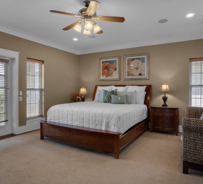 The huge master bedroom has a king bed, private balcony, &amp; en-suite bathroom!
