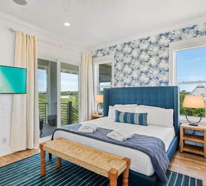 Primary Bedroom with Balcony that leads down to Pool