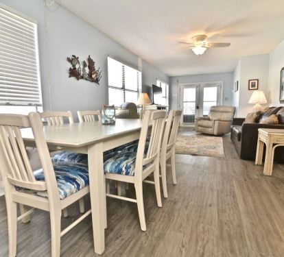 Spacious dining table and comfortable eating area.