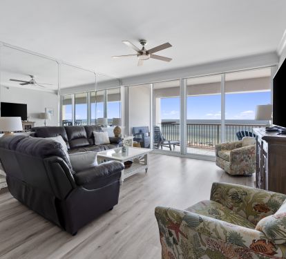 Living Room with Private Balcony Access and 60 Inch Smart TV